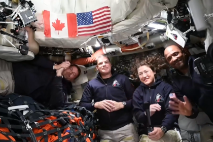 Artemis II crew inside Orion spacecraft during live media event with four astronauts in space capsule
